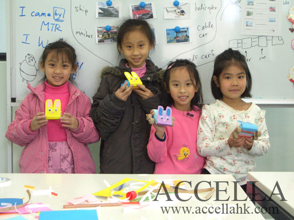 Four students from our XMas 2006 English Crafts program proudly displaying their creations.