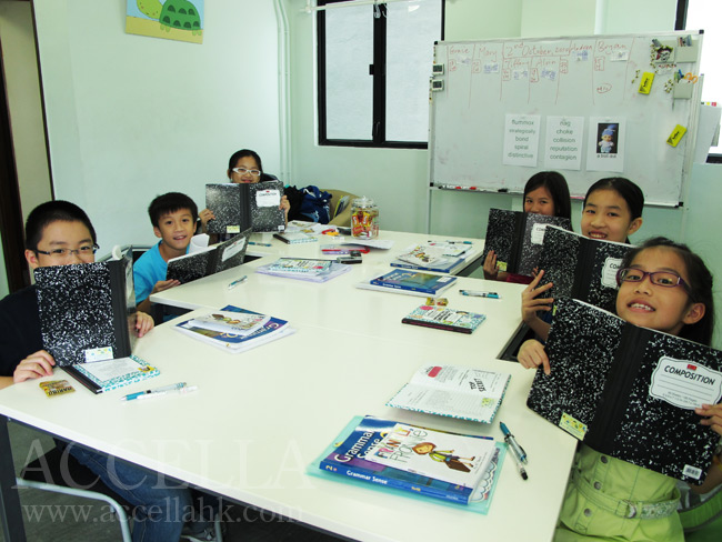 Our students holding their marble composition notebooks.