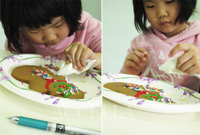 AlvinaT skillfully applying icing to her gingerbread man..