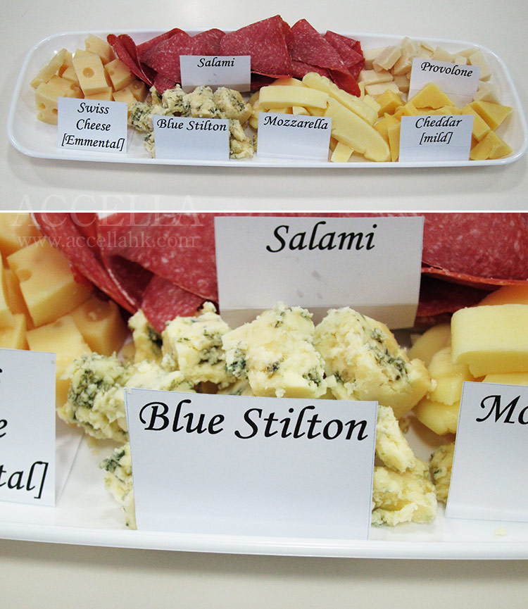 All of the kinds of cheese mentioned in 'The Enormouse Pearl Heist', as well as salami (also mentioned), clockwise from center: salami, provolone, cheddar, mozzarella, [Blue] Stilton, and Swiss (Emmental to be precise).